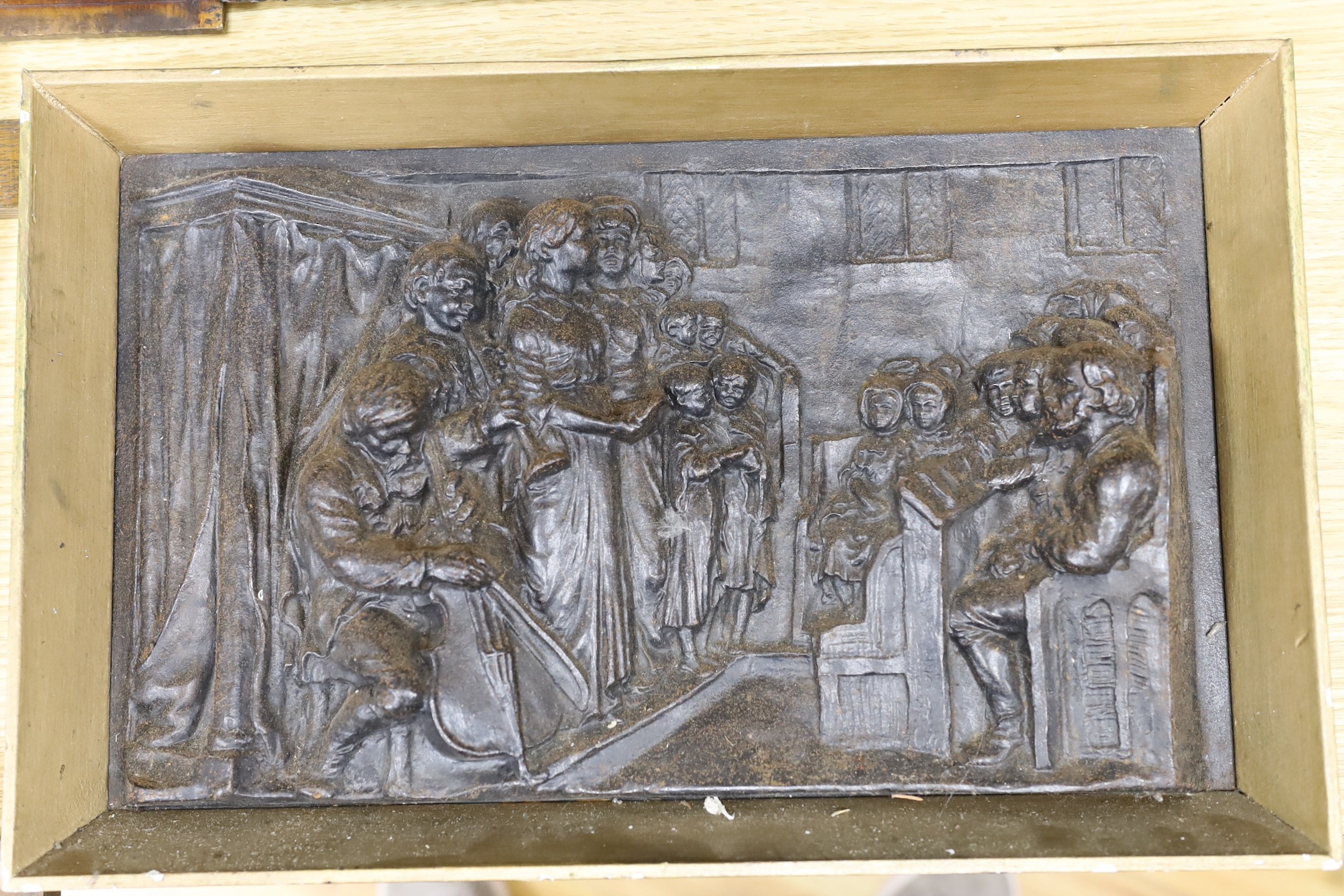 Three assorted cast metal panels together with a carved walnut panel, 39x40cm